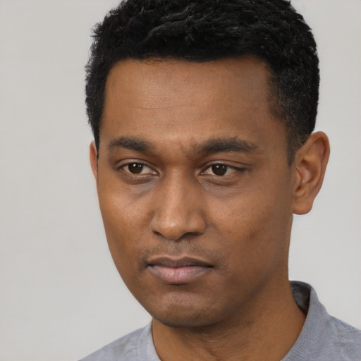 Neutral black young-adult male with short  black hair and brown eyes