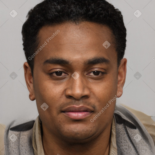 Joyful black young-adult male with short  black hair and brown eyes