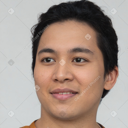 Joyful asian young-adult male with short  brown hair and brown eyes