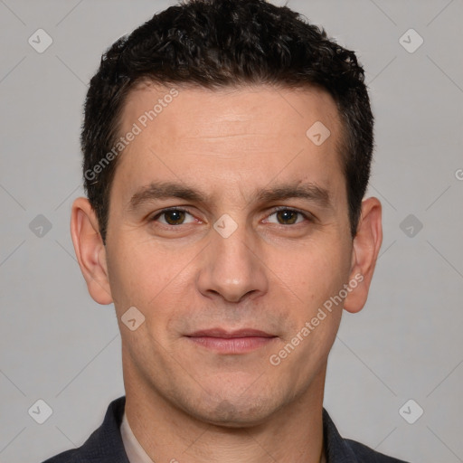 Joyful white adult male with short  brown hair and brown eyes