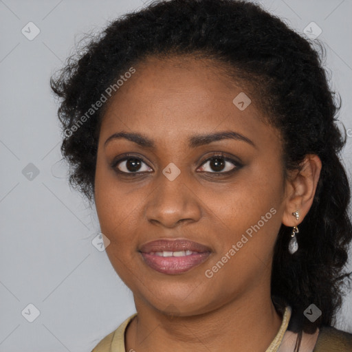 Joyful black young-adult female with long  brown hair and brown eyes