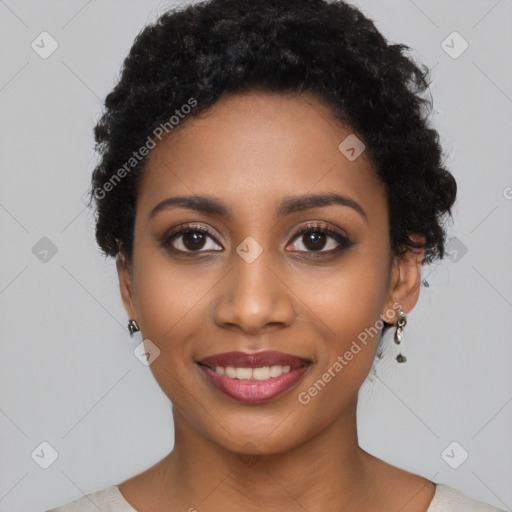 Joyful black young-adult female with short  black hair and brown eyes