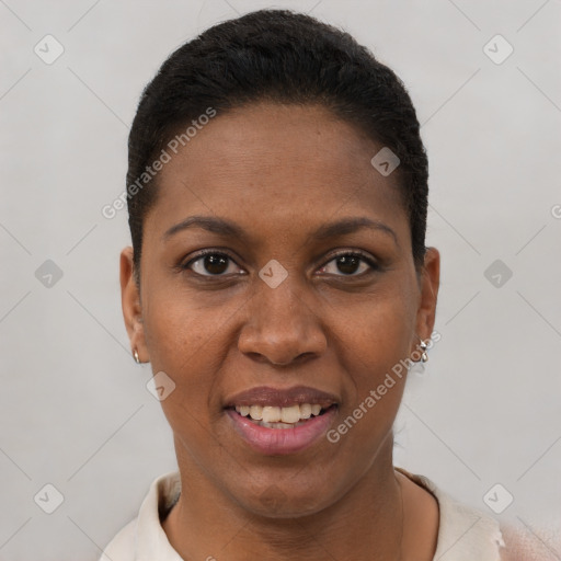 Joyful black young-adult female with short  brown hair and brown eyes