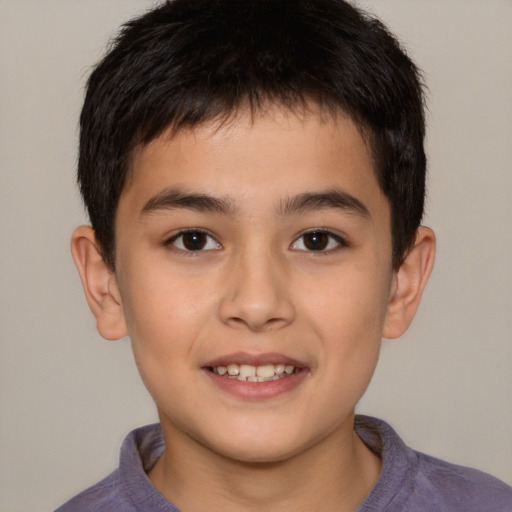 Joyful white child male with short  brown hair and brown eyes