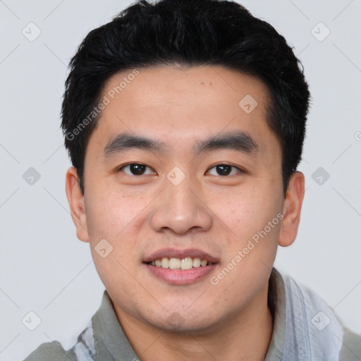 Joyful white young-adult male with short  black hair and brown eyes