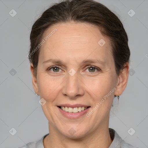 Joyful white adult female with short  brown hair and brown eyes