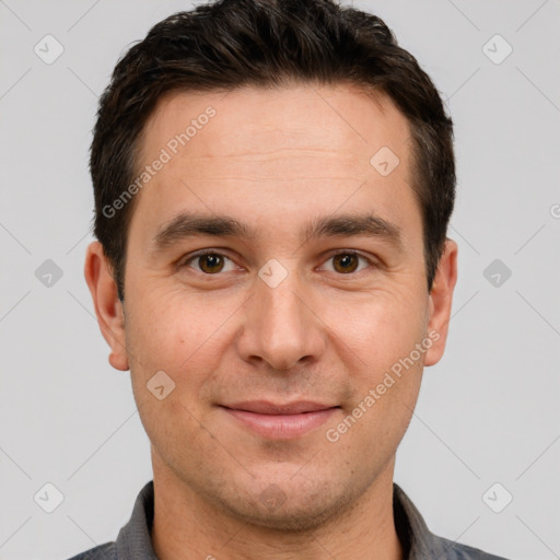 Joyful white adult male with short  brown hair and brown eyes