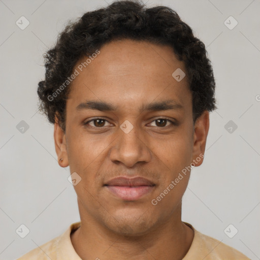 Joyful black young-adult male with short  brown hair and brown eyes