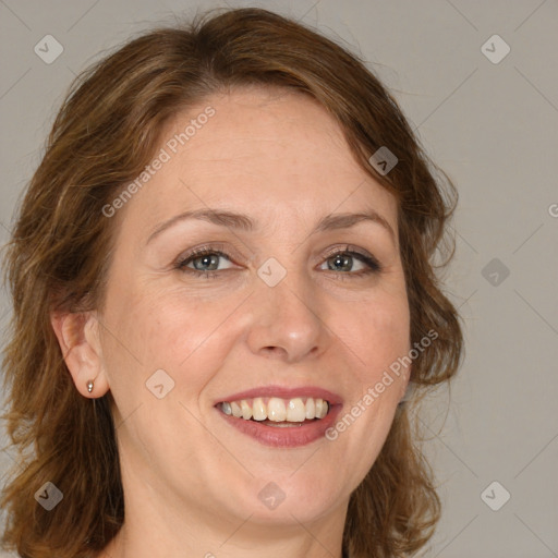 Joyful white adult female with medium  brown hair and green eyes