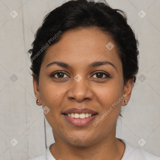 Joyful black young-adult female with short  brown hair and brown eyes