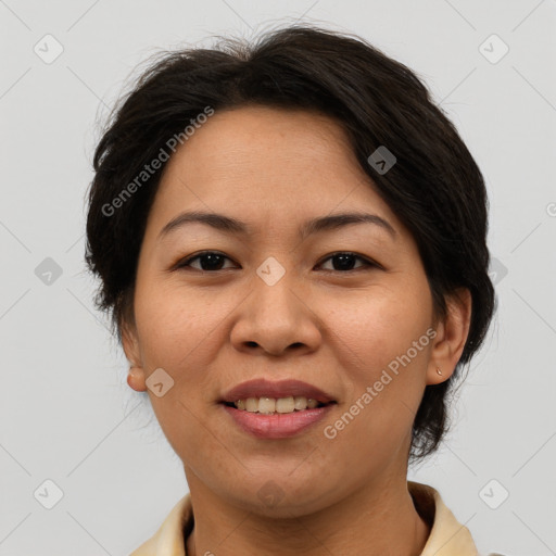 Joyful asian adult female with medium  brown hair and brown eyes