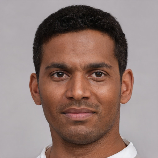 Neutral black young-adult male with short  black hair and brown eyes