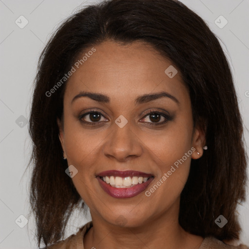 Joyful latino young-adult female with long  brown hair and brown eyes