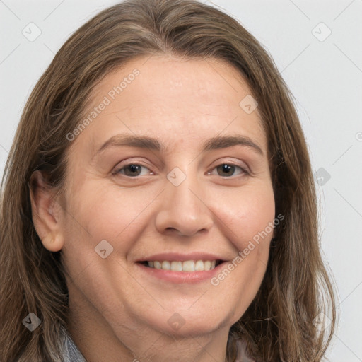 Joyful white adult female with long  brown hair and brown eyes