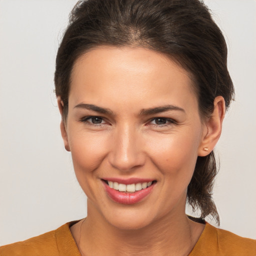 Joyful white young-adult female with medium  brown hair and brown eyes