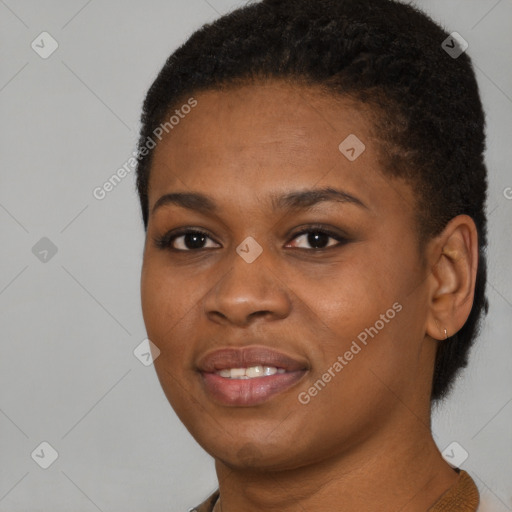 Joyful black young-adult female with short  black hair and brown eyes