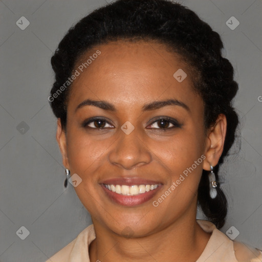 Joyful black young-adult female with short  brown hair and brown eyes