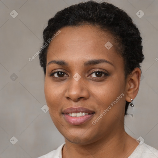 Joyful black young-adult female with short  brown hair and brown eyes