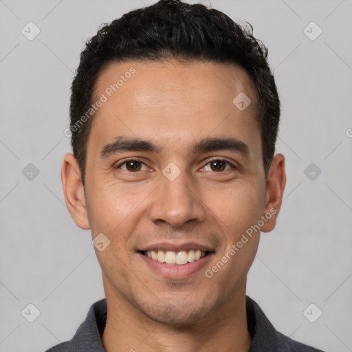 Joyful white young-adult male with short  black hair and brown eyes