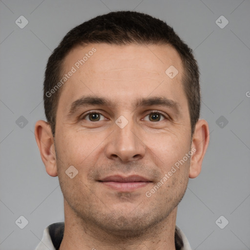 Joyful white adult male with short  brown hair and brown eyes