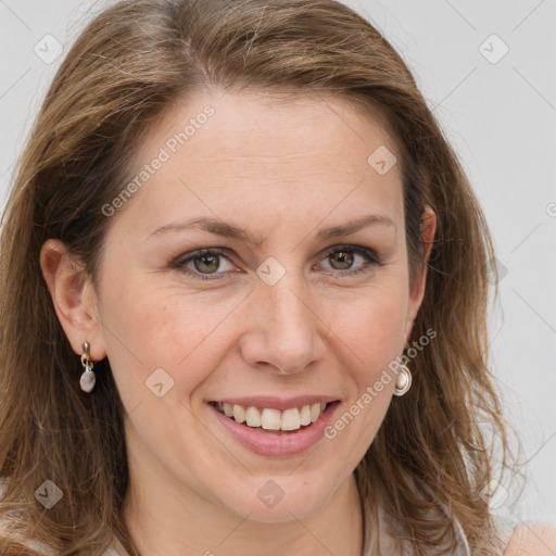 Joyful white adult female with long  brown hair and grey eyes