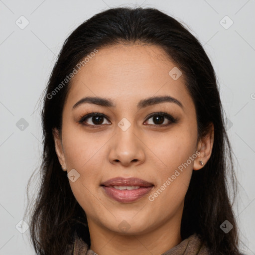 Joyful latino young-adult female with long  brown hair and brown eyes