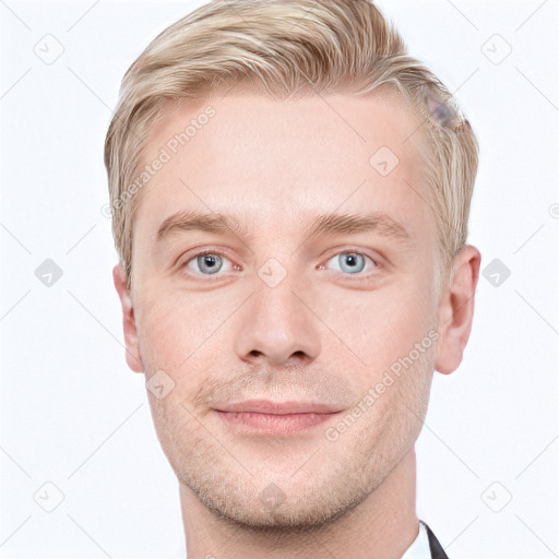 Joyful white young-adult male with short  brown hair and blue eyes