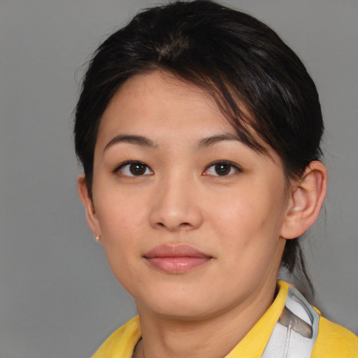 Joyful asian young-adult female with short  brown hair and brown eyes