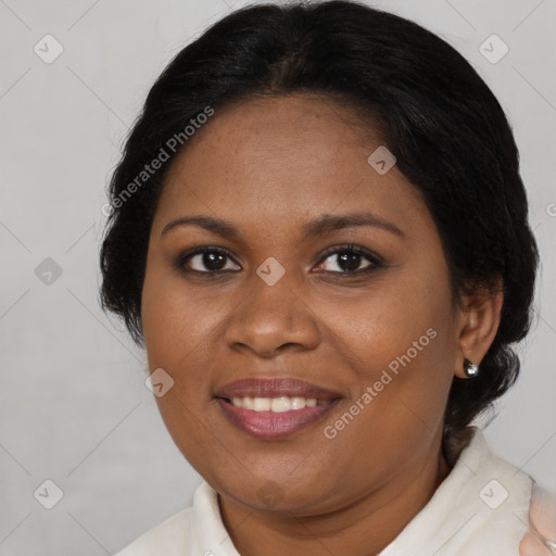 Joyful black adult female with medium  brown hair and brown eyes