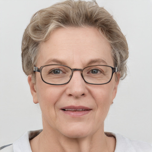 Joyful white middle-aged female with short  brown hair and blue eyes