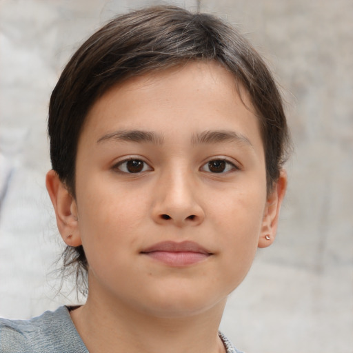 Joyful white child female with short  brown hair and brown eyes