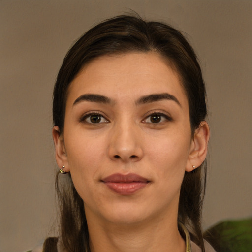 Joyful white young-adult female with long  brown hair and brown eyes