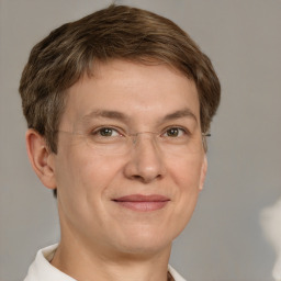 Joyful white adult male with short  brown hair and grey eyes