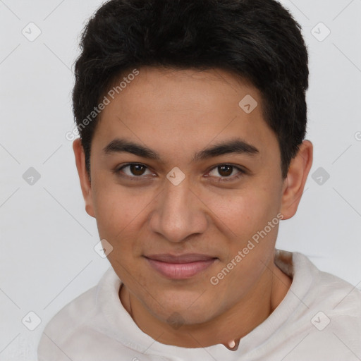 Joyful latino young-adult male with short  brown hair and brown eyes