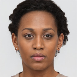 Neutral black young-adult female with short  brown hair and brown eyes