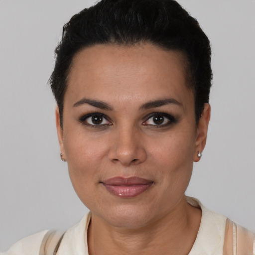 Joyful latino young-adult female with short  brown hair and brown eyes