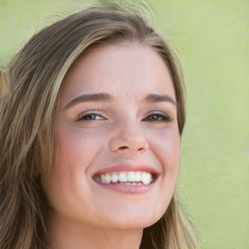 Joyful white young-adult female with long  brown hair and green eyes