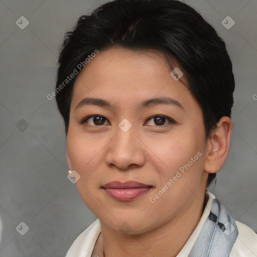 Joyful asian young-adult female with short  brown hair and brown eyes