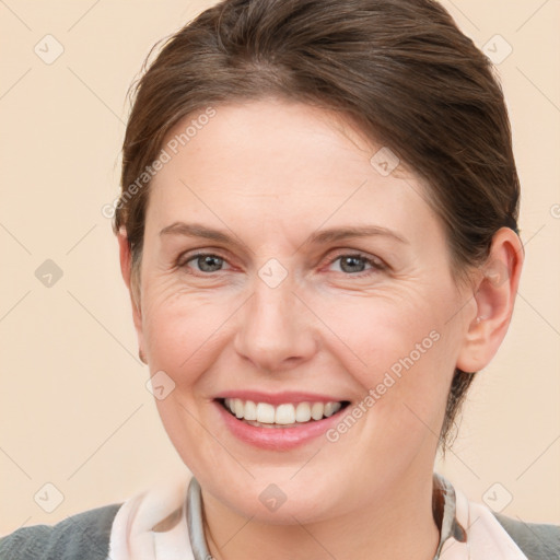 Joyful white young-adult female with medium  brown hair and blue eyes