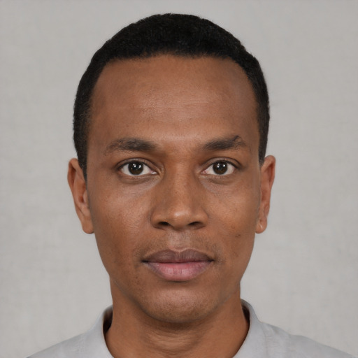 Neutral black young-adult male with short  black hair and brown eyes