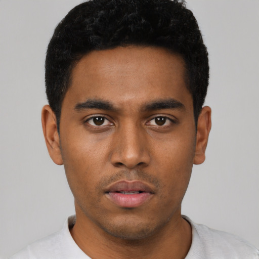 Neutral black young-adult male with short  black hair and brown eyes