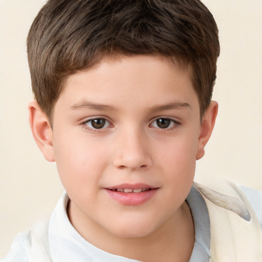 Joyful white child male with short  brown hair and brown eyes