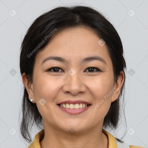 Joyful latino young-adult female with medium  brown hair and brown eyes