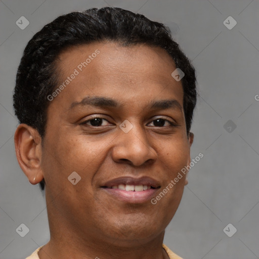 Joyful latino young-adult male with short  brown hair and brown eyes