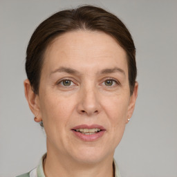 Joyful white adult female with short  brown hair and grey eyes