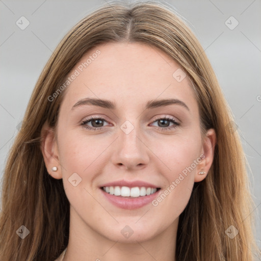 Joyful white young-adult female with long  brown hair and grey eyes