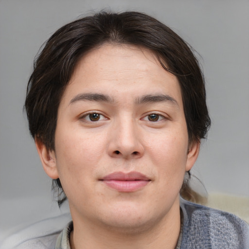 Joyful asian young-adult male with medium  brown hair and brown eyes