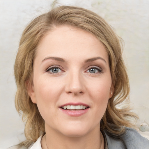 Joyful white young-adult female with medium  brown hair and blue eyes