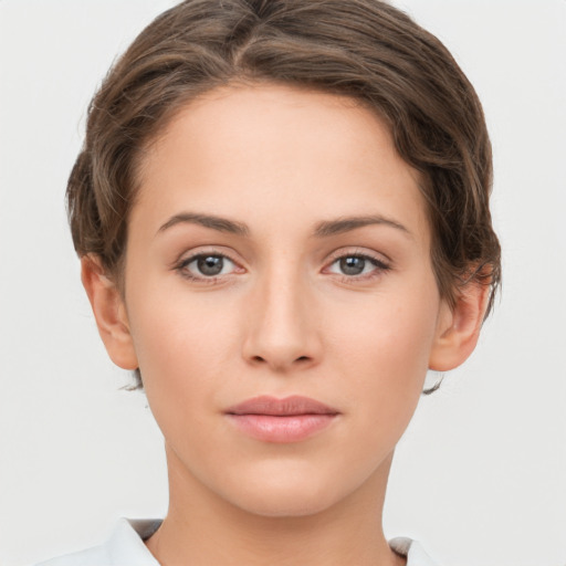 Neutral white young-adult female with short  brown hair and grey eyes