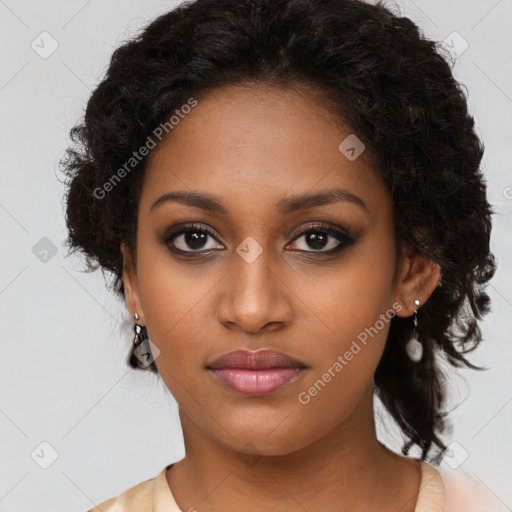 Joyful black young-adult female with long  brown hair and brown eyes